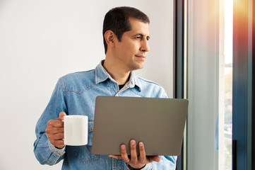 Man working online at home on a laptop