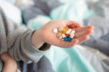 Pills in hand, Taking Your Medication. Home treatment