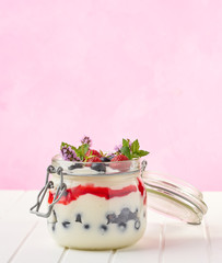dessert in a jar on pink background