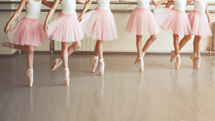 Ballet kids legs on the pointes shoes dance class