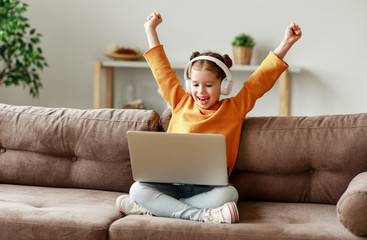 Girl celebrating victory in video game.