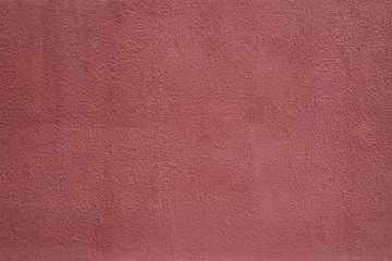 red background texture cement wall. maroon. embossed background. Texture of paint on grooved plaster.