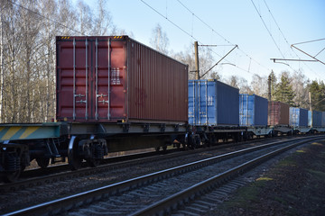 Cargo containers transportation on freight train by railway. Coronavirus Wreaks Havoc On Global...