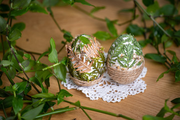 Forest themed Easter eggs decorated with natural leafs – holiday table decoration during celebration - obrazy, fototapety, plakaty