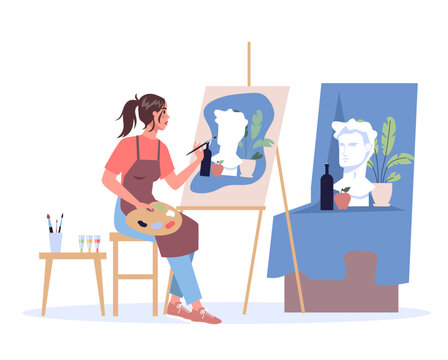 Woman artist sitting at the easel and painting