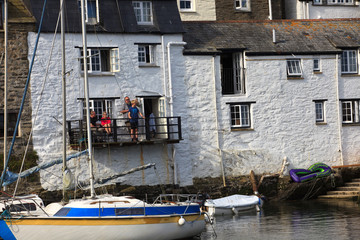Fototapeta na wymiar Polperro (England), UK - August 16, 2015: Polperro harbour and village, Cornwall, England, United Kingdom. .