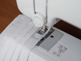 Sewing a protective medical mask to protect against COVID-19. Handmade (Do-it-yourself) cotton...