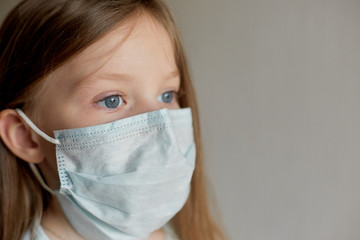 self-isolation and quarantine, portrait of a girl in a medical mask, protection from viruses and...