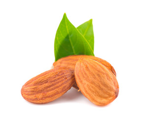 Almonds with green leaves an isolated on white background