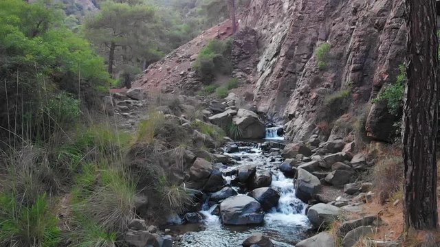 drone shot in kakopetria Cyprus mountains across the river. Captured in slow motion 120fps