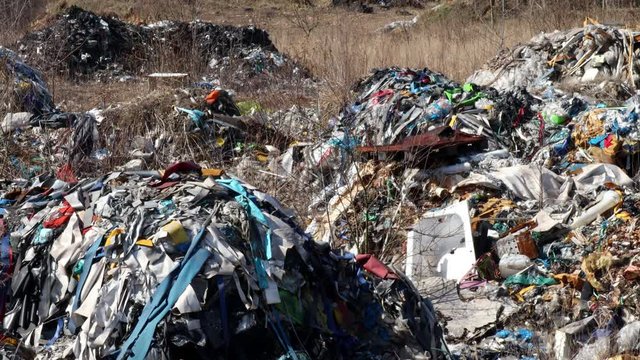 Household waste dumped in the countryside, polluted environment