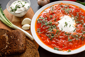 Traditional Ukrainian Russian borscht with white beans on the bowl