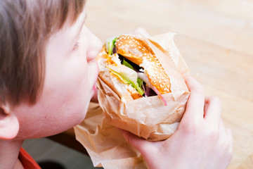 Child eating hamburger