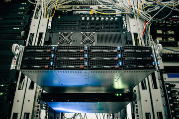 Powerful computing equipment works in the server room. Rack with hosting servers of large web...