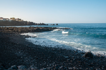 Fototapeta na wymiar waves of the atlantic ocean break on rocks and boulders