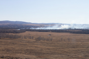 Smoke in the sky from a forest fire. Environmental pollution. Aerial view