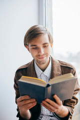 Young man reading a book