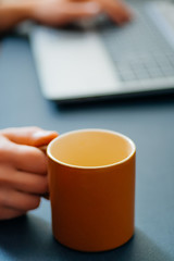 Coffee cup and laptop for business.