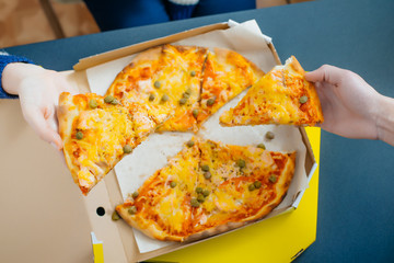 boy and girl share a pizza