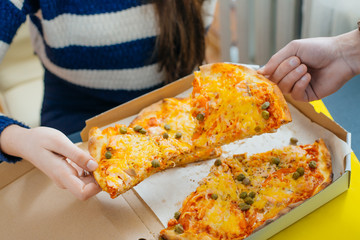 boy and girl share a pizza