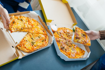 boy and girl share a pizza
