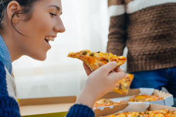 boy and girl share a pizza