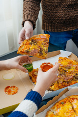 boy and girl share a pizza