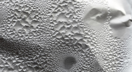 Water Drops On Foil Grey White Background, Texture colorful water drop. Abstract detail of moisture condensation problems, hot water vapor condensed on foil close up