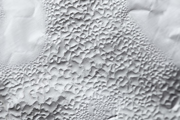 Water Drops On Foil Grey White Background, Texture colorful water drop. Abstract detail of moisture condensation problems, hot water vapor condensed on foil close up