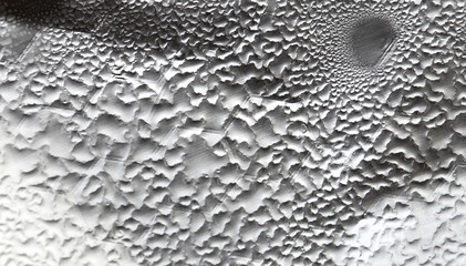 Water Drops On Foil Grey White Background, Texture colorful water drop. Abstract detail of moisture condensation problems, hot water vapor condensed on foil close up