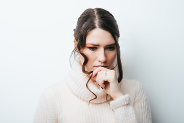 Closeup portrait of young unhappy woman, biting her nails looking at you with craving for...