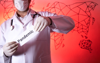 COVID-19 Pandemic Coronavirus. A doctor with a paper with pandemic holding on hand, protect from...