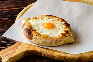 khachapuri with cheese and quail egg