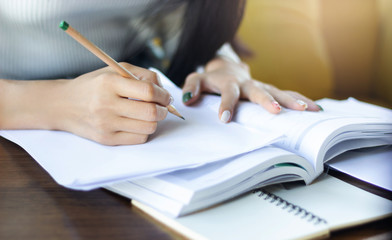 Close-up, Young female writing her plan on paper, Concept work from home