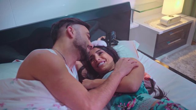 Happy couple having fun on bed - Young romantic lovers intimate moments - Intimacy and love relationship concept.