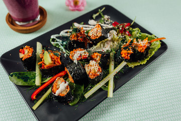 Raw vegan nori hand rolls close up view