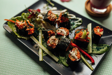 Raw vegan nori hand rolls close up view