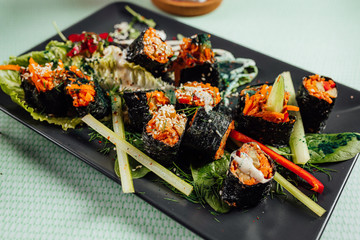 Raw vegan nori hand rolls close up view