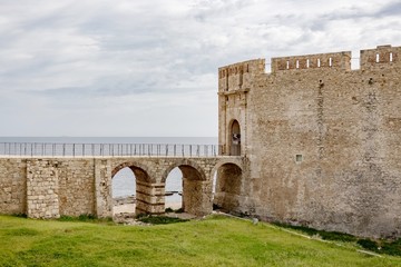 Fototapeta na wymiar The viaduct bridge to the Castello Maniace citadel in Siracusa, Sicily, Italy in a sunny day with clouds