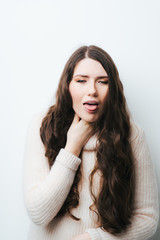 on a white background a young girl with long hair sore throat