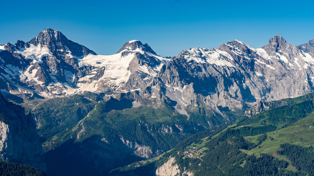 Switzerland, Panoramic view on Murren and green Alps around