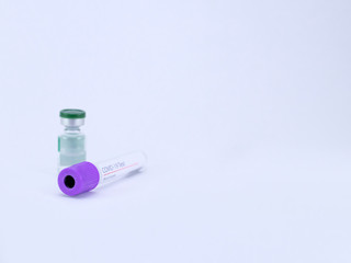 A blood sample tube for Coronavirus test with a vial on white background.
