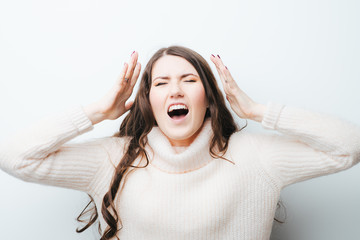 on a white background young girl with long hair screaming
