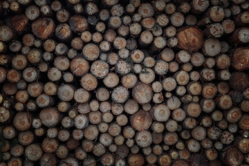 pile stacked natural sawn wooden logs background, top view