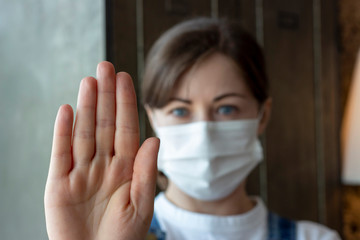 Portrait of a girl in a medical mask, stop coronavirus, selective focus.