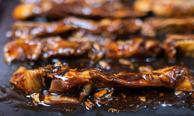 Lamb strips marinated with oyster and soy sauce In an oven tray. Selective focus.