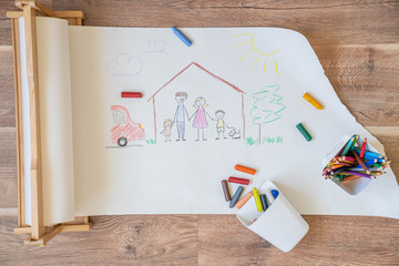 Drawing of a happy falimy with two kids in the house, top view