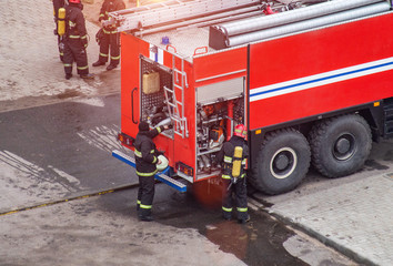 Firefighters rescue extinguish a fire in a residential building. Necessary fire equipment in a fire...