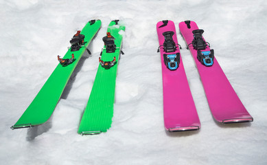 Color mountain skis with climbing skins for ski touring on snow