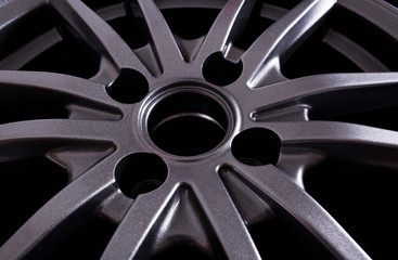 Landing hole in a cast modern car disk, background, industry